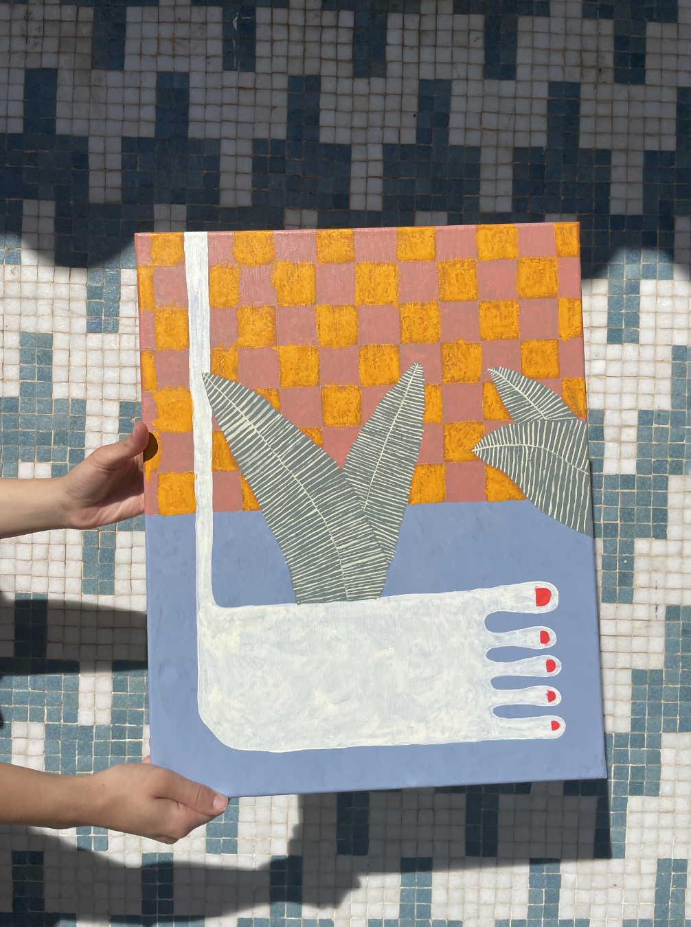 Foot painting on orange and pink checker