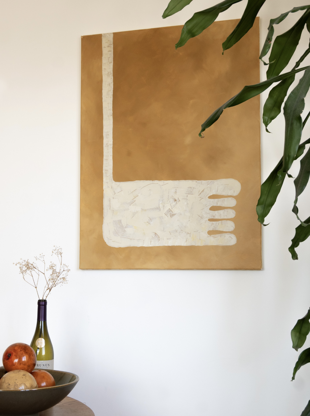 Cream foot painting on ochre canvas